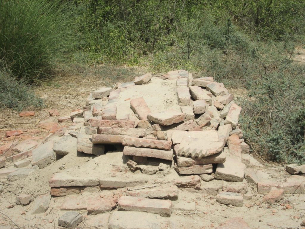 Bricks scattered over graves of soldiers at Halani battlefield