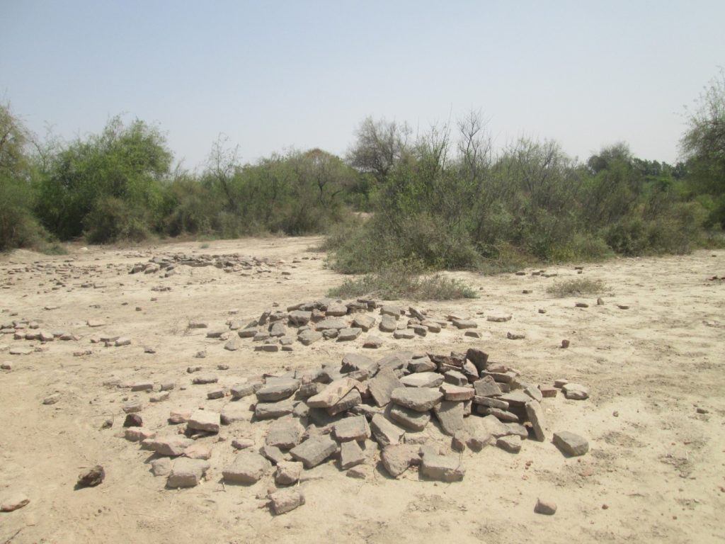 Another view of Bricks scattered over graves of soldiers