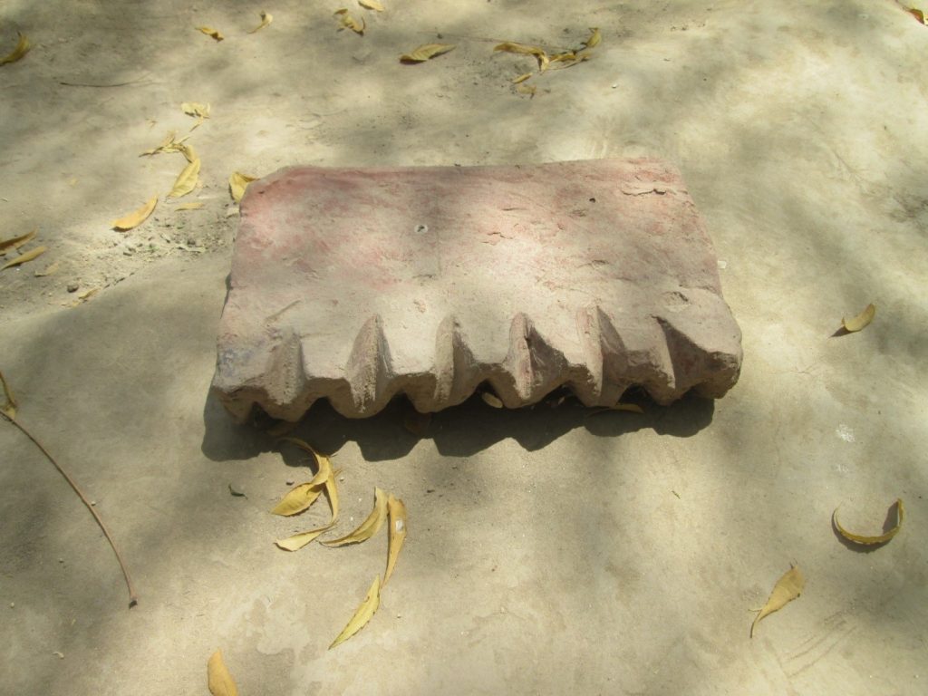 Wavy shaped brick found at Halani battlefield