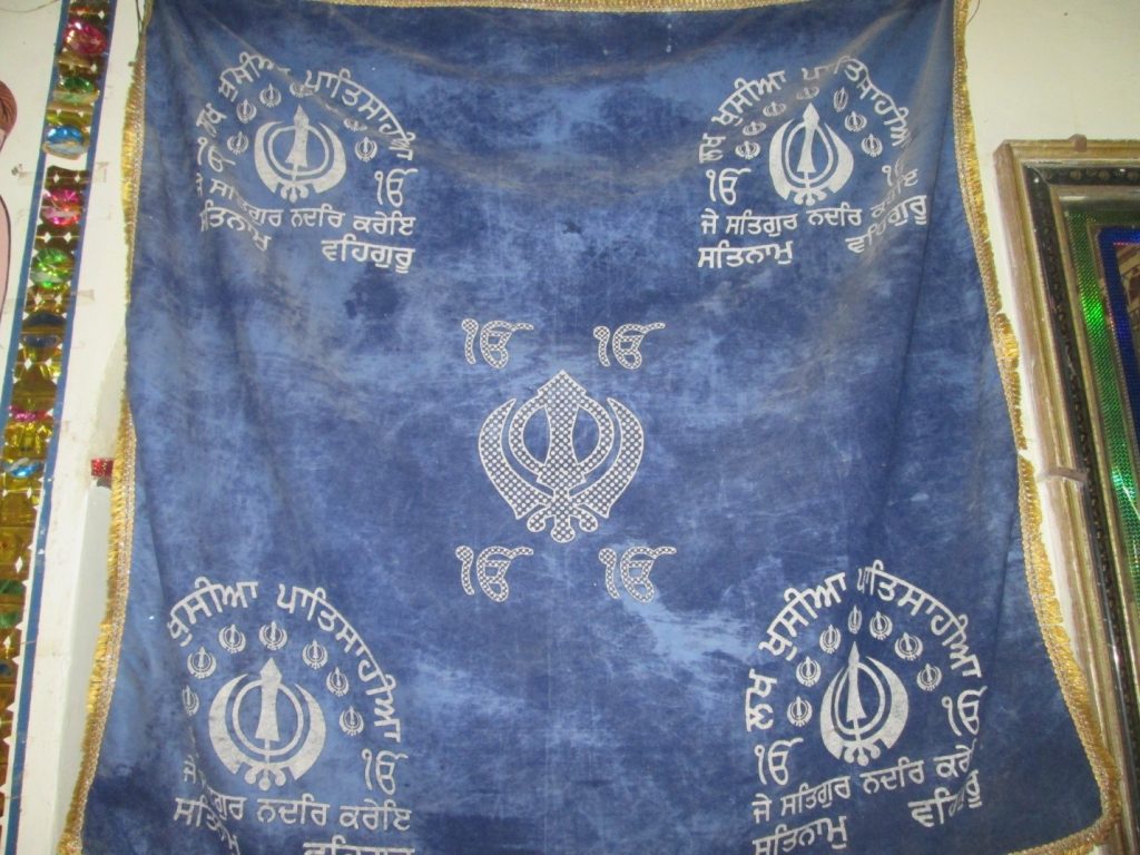 Hanging Khalsa Flag at Darbar Sahib Halani
